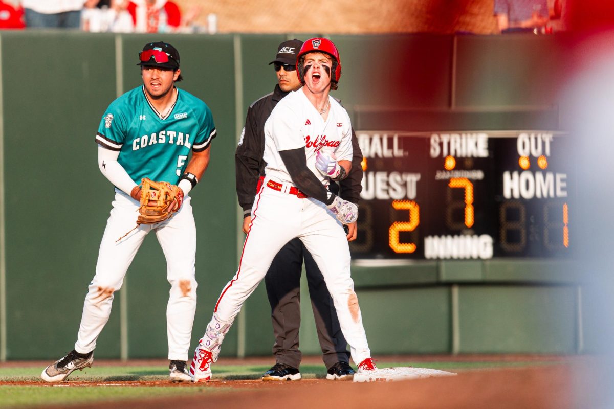 Junior second baseman Luke Nixon yells after hitting a triple and driving in a run during the game against Coastal Carolina in Doak Field at Dail Park on Tuesday, March 3, 2026. The Wolfpack defeated the Chanticleers 6-4.