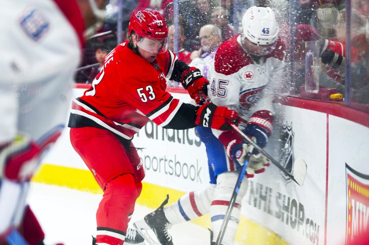 Right wing Jackson Blake battles an opponent during the game versus the Montreal Canadiens at the Lenovo center on Sunday, March 29, 2026. The Canadiens beat the Hurricanes 3-1.