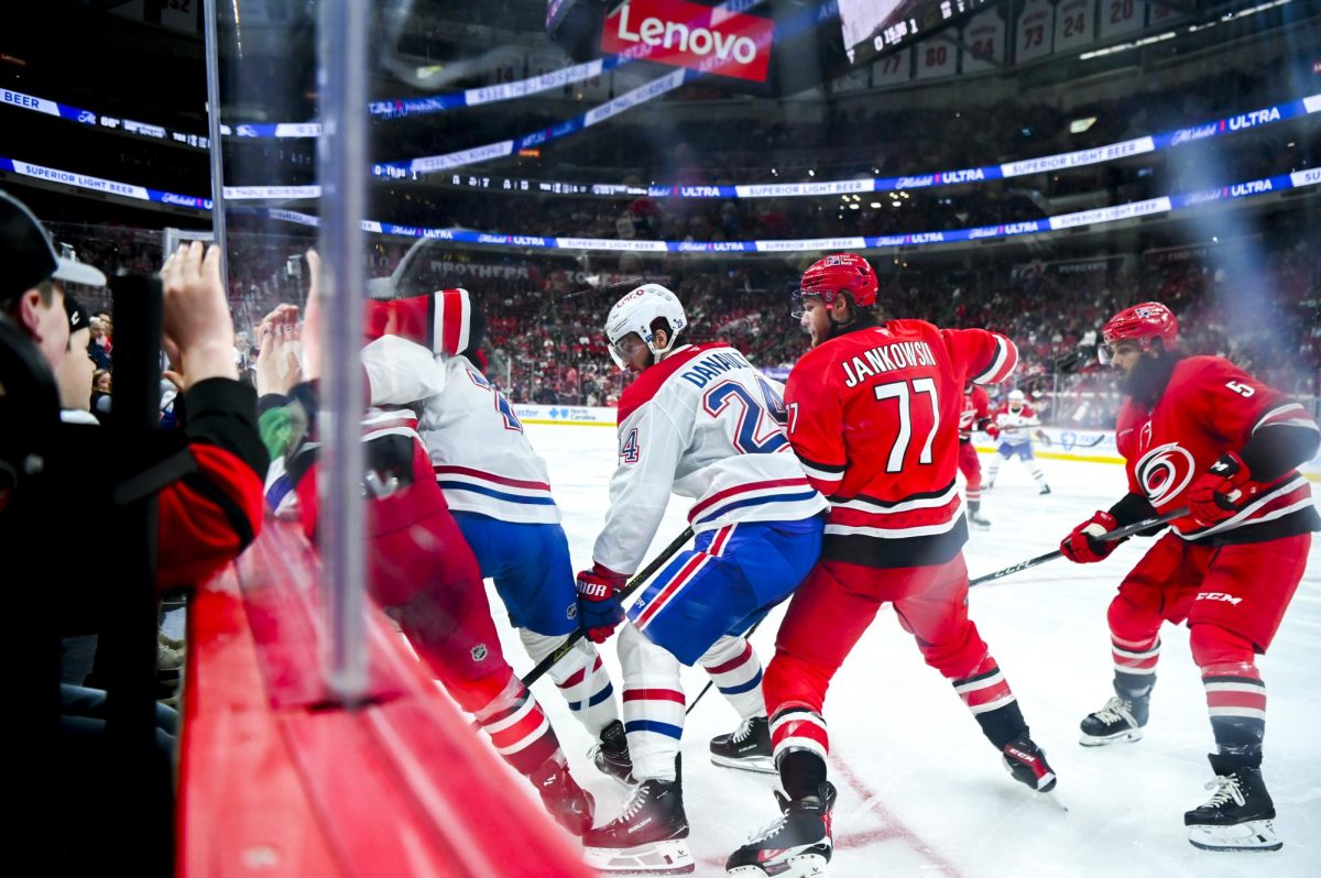 Left wing Mark Jankowski and defenseman Jalen Chatfield battle opponents for the puck during the game versus the Montreal Canadiens at the Lenovo center on Sunday, March 29, 2026. The Canadiens beat the Hurricanes 3-1.