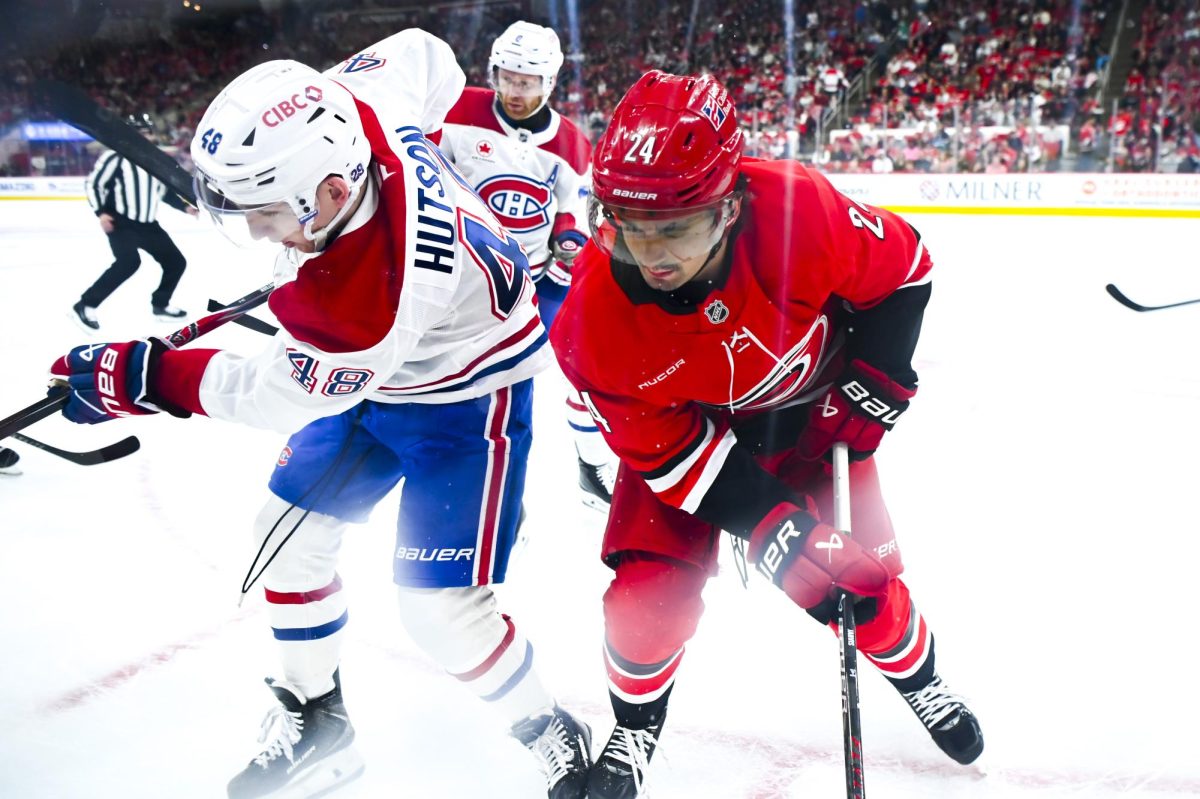 Center Seth Jarvis battles an opponent for the puck during the game versus the Montreal Canadiens at the Lenovo center on Sunday, March 29, 2026. The Canadiens beat the Hurricanes 3-1.