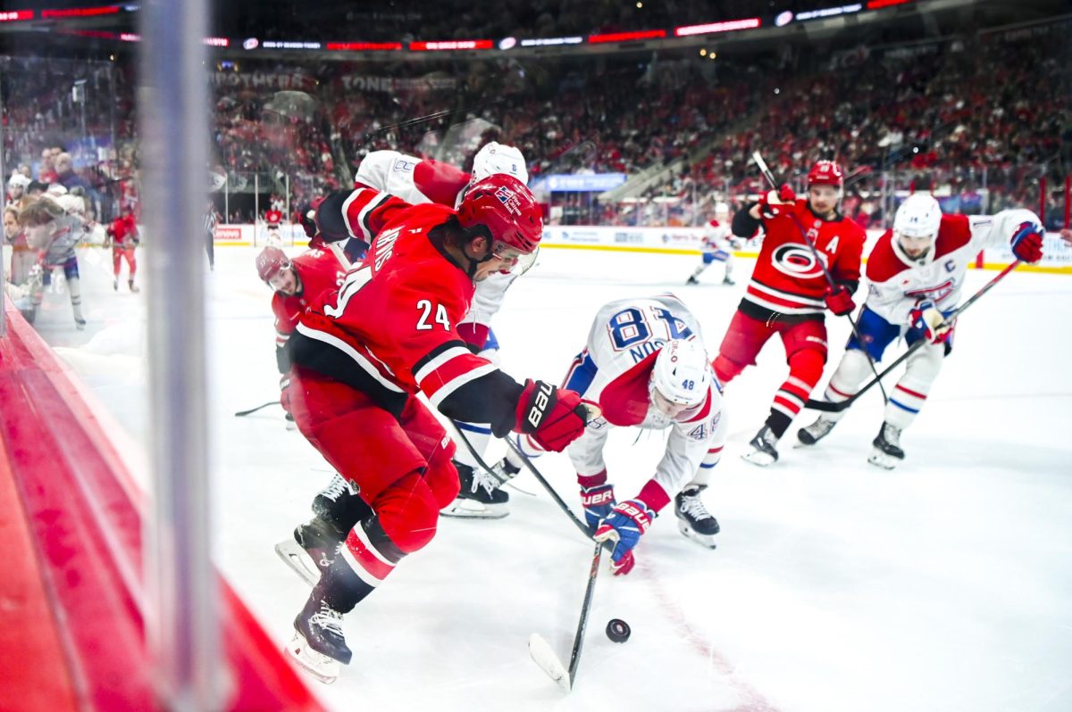 Center Seth Jarvis battles opponents for the puck during the game versus the Montreal Canadiens at the Lenovo center on Sunday, March 29, 2026. The Canadiens beat the Hurricanes 3-1.