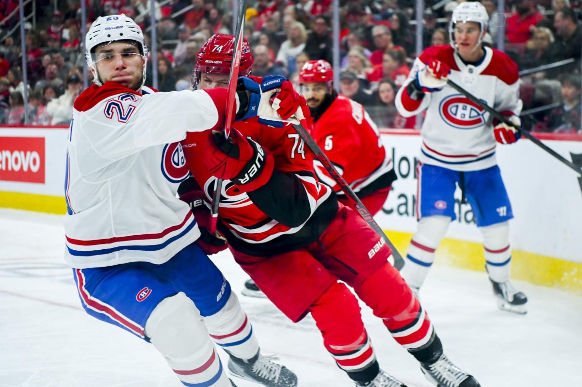 Defenseman Jaccob Slavin battles an opponent during the game versus the Montreal Canadiens at the Lenovo center on Sunday, March 29, 2026. The Canadiens beat the Hurricanes 3-1.