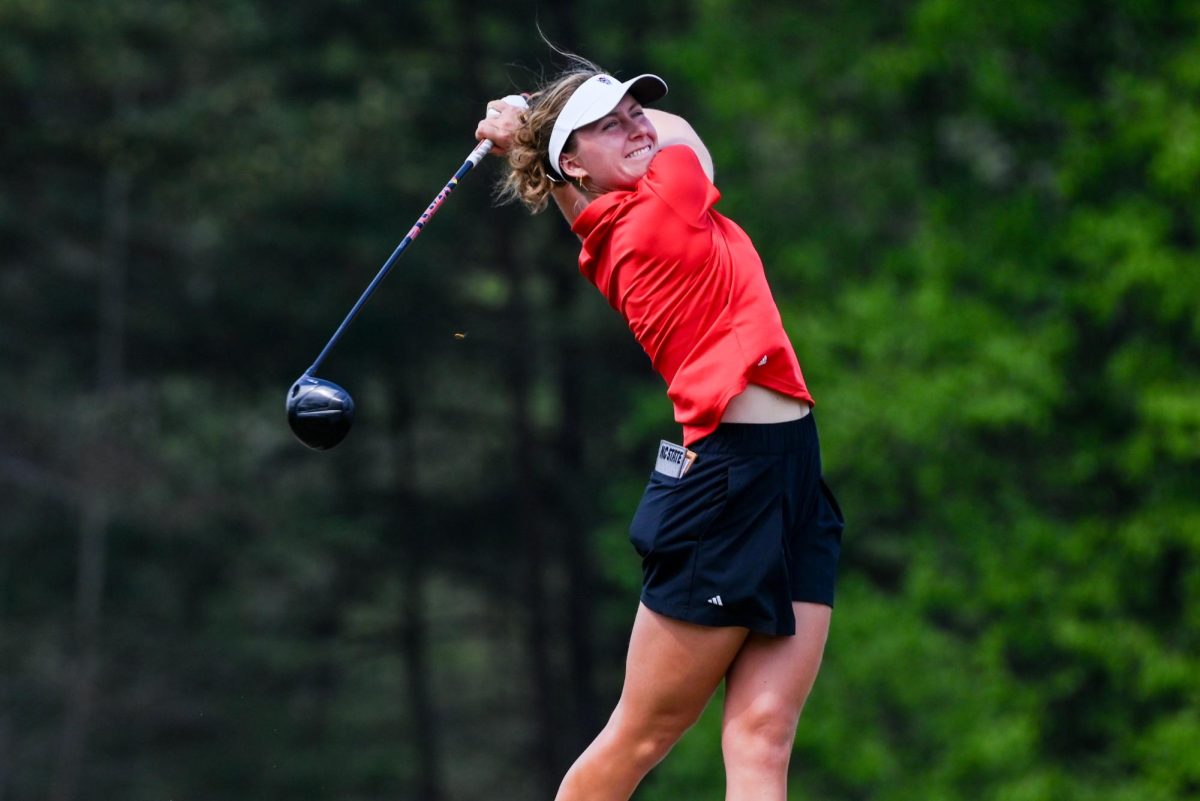 Sophomore Marie Madsen follows through on her stroke during the City of Oaks Collegiate at Lonnie Poole Golf Course on Monday, Mar. 23, 2026. At the end of Monday's play, Madsen was in first place.  After the second round, the Wolfpack was in the lead by -15.