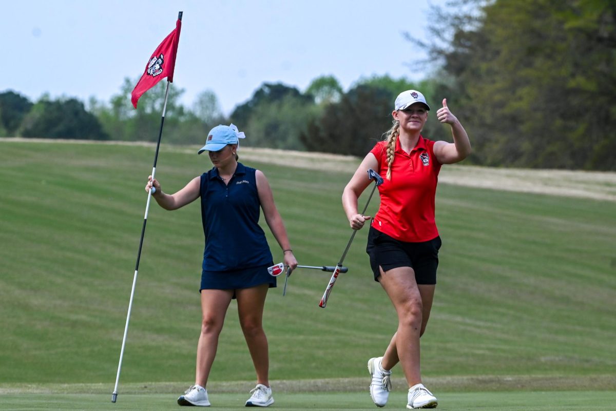 Freshman Lindsay McGrath holds a thumbs-up after a putt during the City of Oaks Collegiate at Lonnie Poole Golf Course on Monday, Mar. 23, 2026. At the end of Monday's play, McGrath, Sullivan, and Hildreth were part of a five-way tie for seventh place. After the second round, the Wolfpack was in first place with a score of +6.