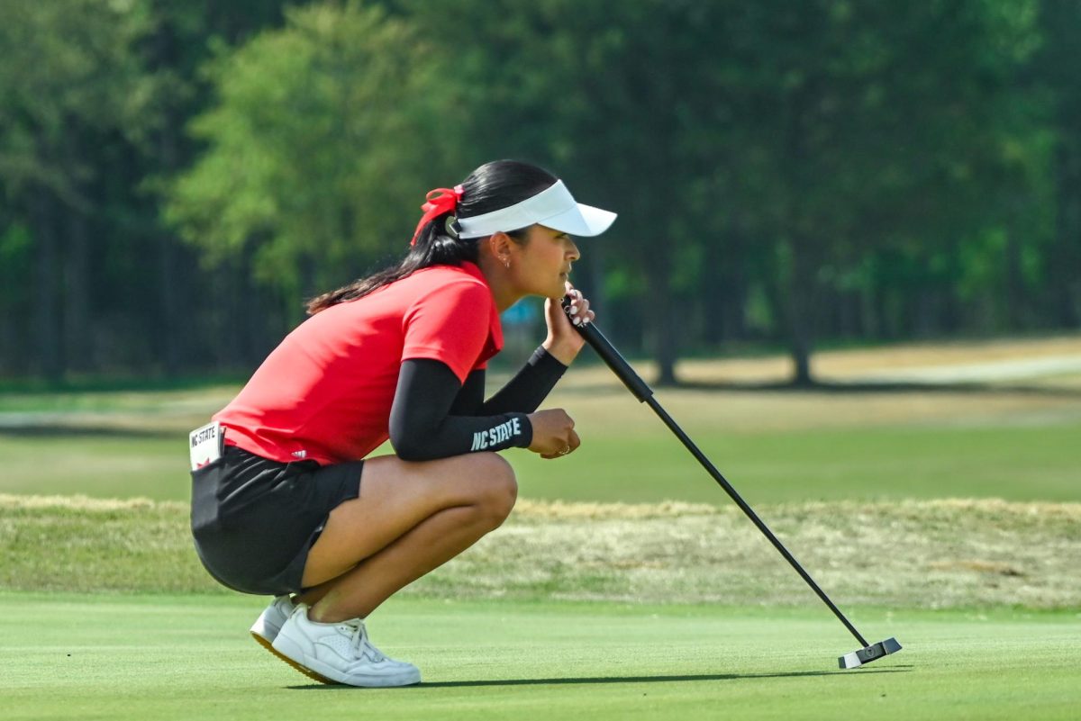 Senior Vania Simont reads the green during the City of Oaks Collegiate at Lonnie Poole Golf Course on Monday, Mar. 23, 2026. At the end of Monday's play, Simont was tied for third place. After the second round, the Wolfpack was in the lead by -15.