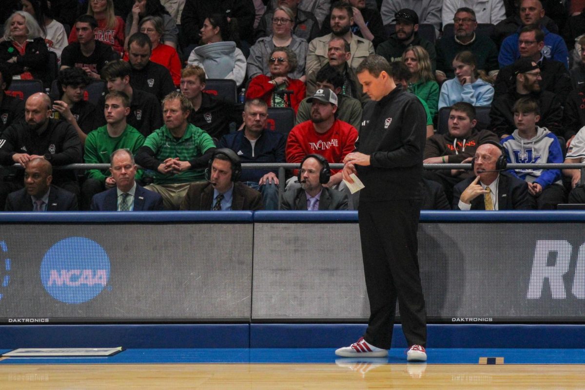 Head coach Will Wade looks down during the game against Texas at UD Arena in Dayton, Ohio on Tuesday, March 17, 2026. This season marks Wade's eighth NCAA Tournament appearance. NC State lost to Texas 68-66.