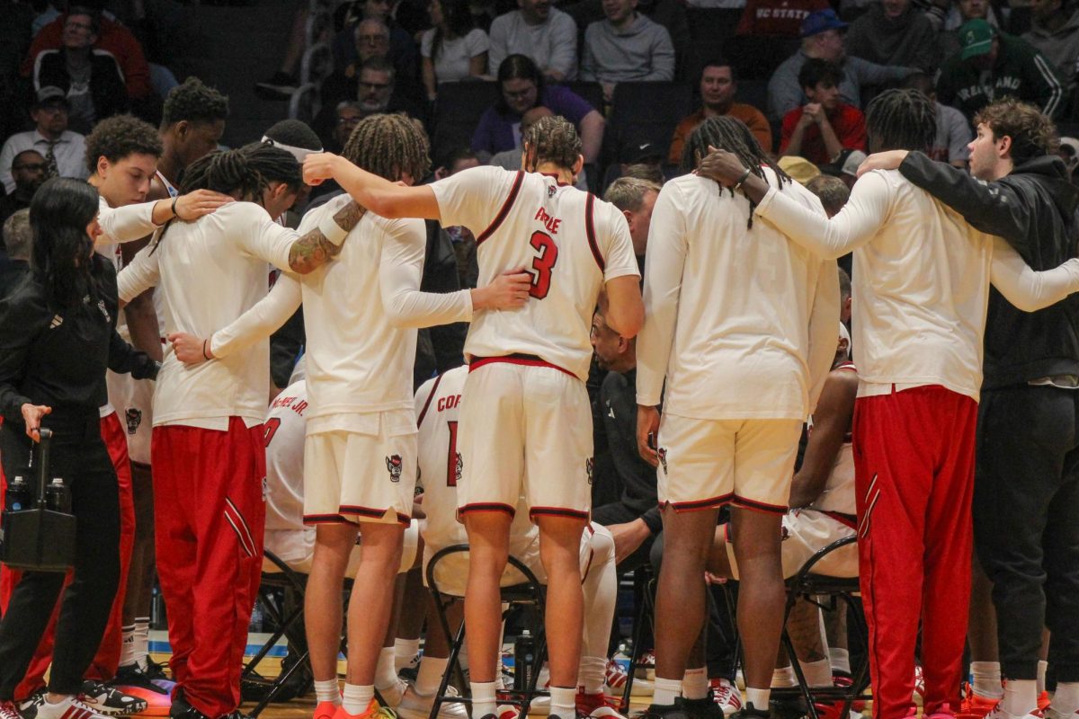 The NC State team huddles together during the game against Texas at UD Arena in Dayton, Ohio on Tuesday, March 17, 2026. NC State lost to Texas 68-66.