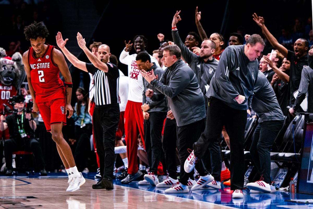Sophomore guard Paul McNeil Jr. reacts as he makes a three pointer to take the lead during the game against Virginia in the Spectrum Center on Thursday, March 12, 2026. McNeil scored 26 points. NC State fell to Virginia 81-74.