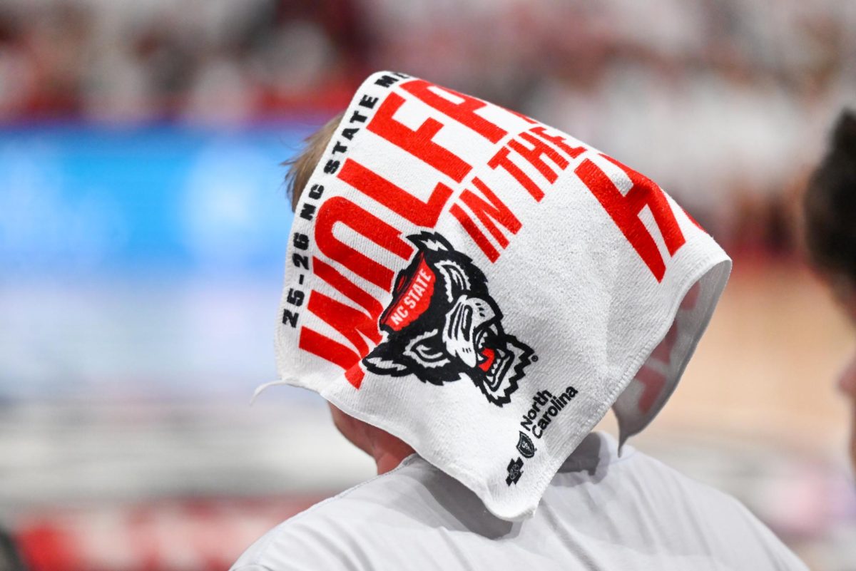 A rally towel rests on top of a fan's head during the game against Duke at the Lenovo Center on Monday, March 2, 2026. The Wolfpack fell to the Blue Devils 93-64. 