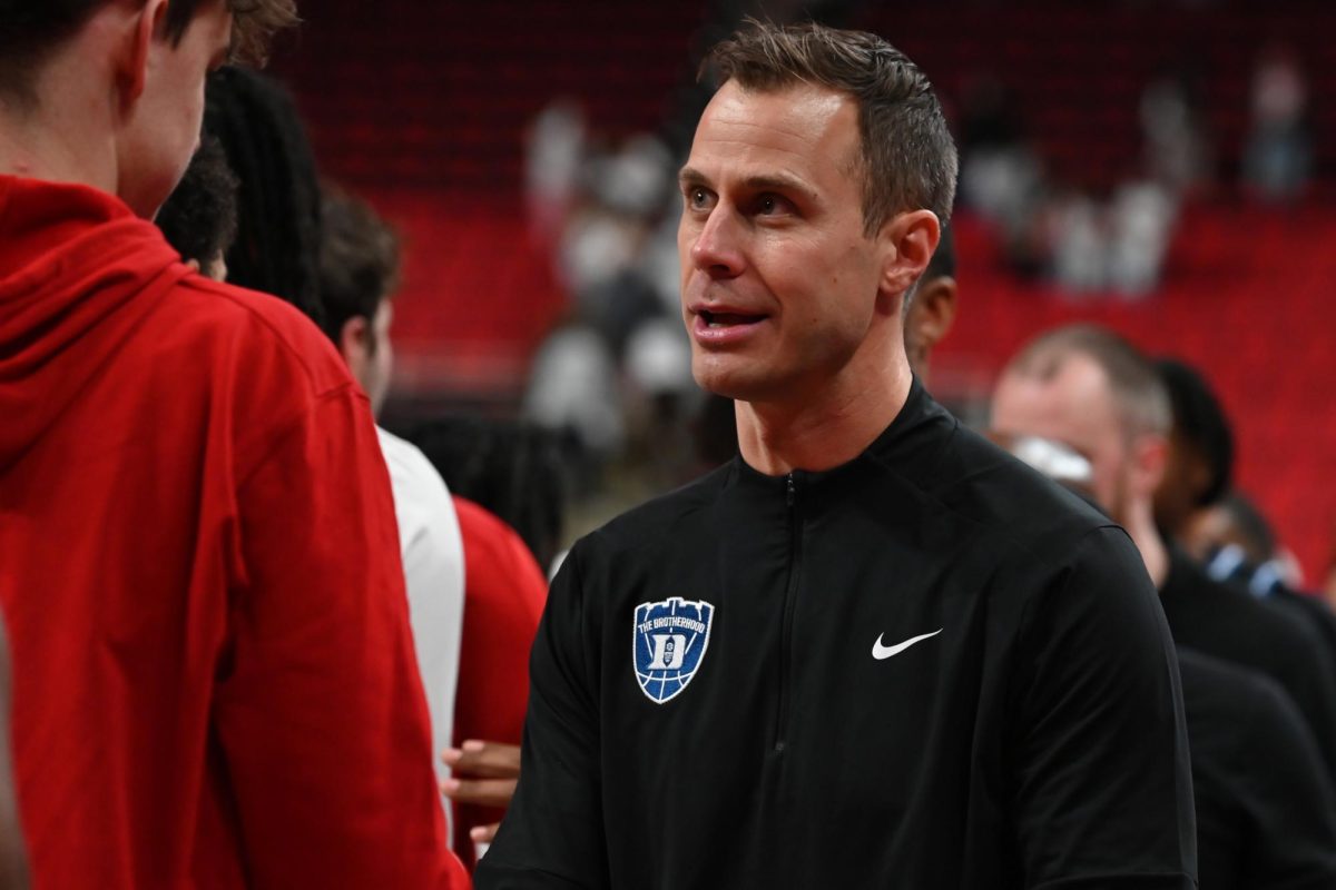 Duke head coach Jon Scheyer shakes hands with the NC State team following the game at the Lenovo Center on Monday, March 2, 2026. The Wolfpack fell to the Blue Devils 93-64. 