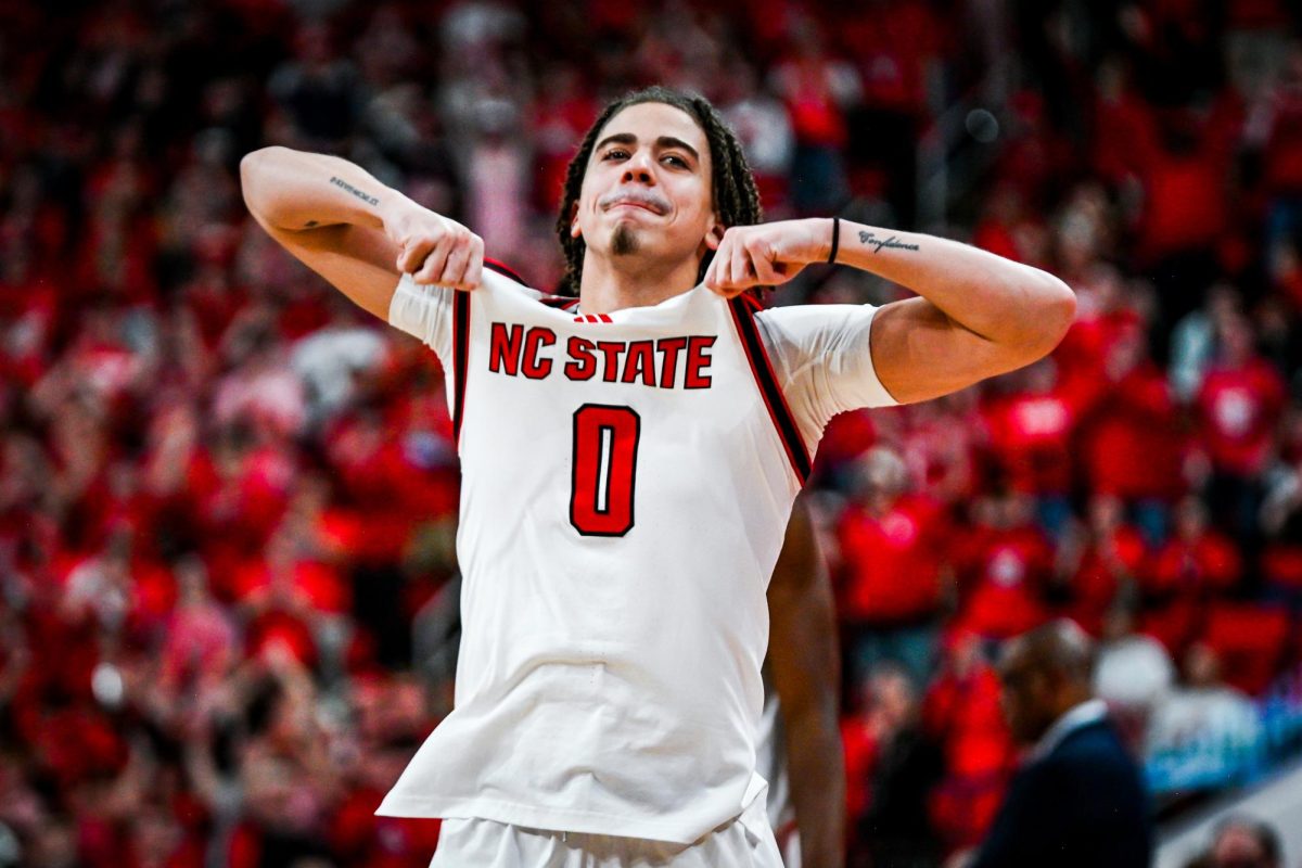 Senior guard Jordan Snell hypes up the crowd as he gets subbed in during the game against North Carolina at the Lenovo Center on Tuesday, Feb. 17, 2026. The Wolfpack defeated the Tar Heels 82–58.