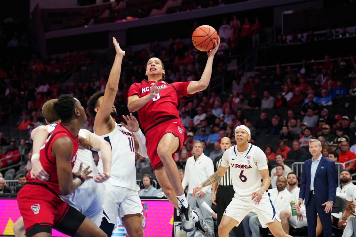 Freshman guard Matt Able attempts a layup during the game against Virginia in the Spectrum Center on Thursday, March 12, 2026. Able recorded 12 points. NC State fell to Virginia 81-74.
