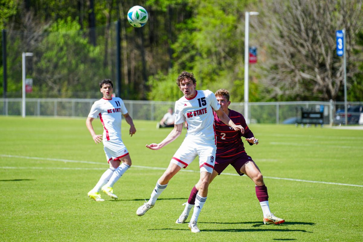 Redshirt senior forward Aidan Payne attempts to win the ball in the air during the match against Virginia Tech at WakeMed Soccer Park on Saturday, March 28, 2026. NC State fell to Virginia Tech 1-0.