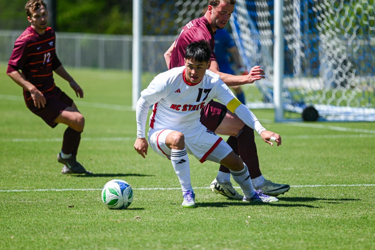 Graduate midfielder Caden Tolentino holds possession of the ball during the match against Virginia Tech at WakeMed Soccer Park on Saturday, March 28, 2026. NC State fell to Virginia Tech 1-0.