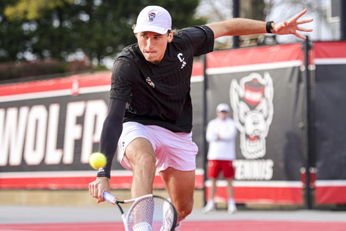 Senior Martin Borisiouk lunges for the ball during his doubles match with redshirt sophomore Jules Leroux during the match against Virginia at J.W. Isenhour Tennis Center on Friday, March 20, 2026. Borisiouk and Leroux lost their doubles match 6-4. NC State fell to Virginia 4-1.