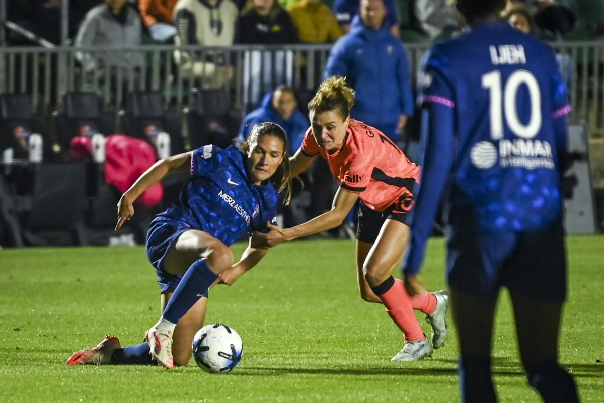 Bay FC forward Cristiana Girelli fouls midfielder Carly Wickenheise during the game between the North Carolina Courage and Bay Football Club in the First Horizon Stadium on Saturday, March 29, 2026. Bay FC defeated the Courage 3-1.