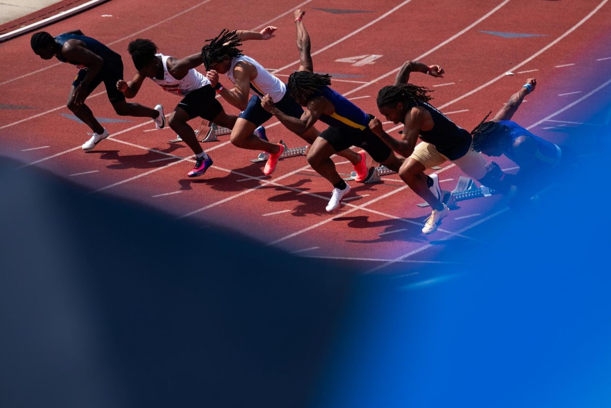 Runners jump out of the blocks in the men's 100m dash timed finals during the 2026 Raleigh Relays held at Derr Track on Friday, March 27, 2026.