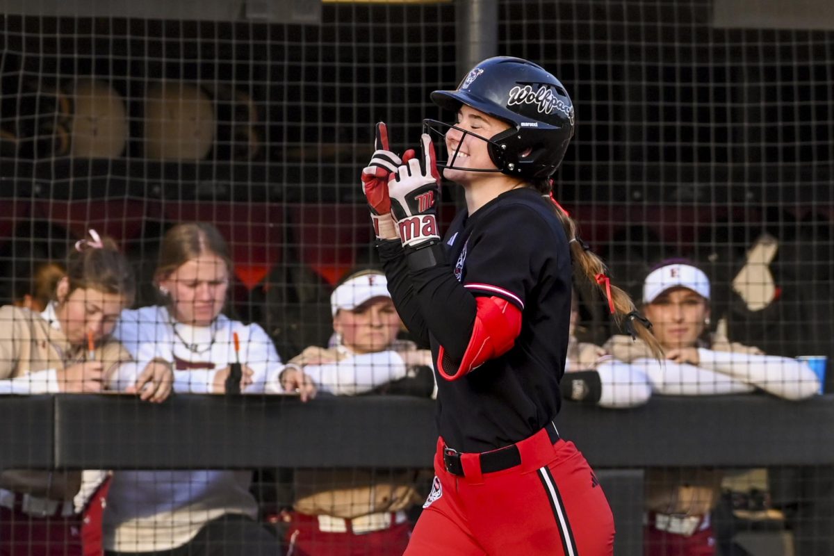 Freshman utility Morgan Talley smiles while heading to home plate during the game against Elon at Dail Softball Stadium on Tuesday, March. 3, 2026. Talley was at bat three times with three hits, three runs and six RBIs. NC State beat Elon 14-2.