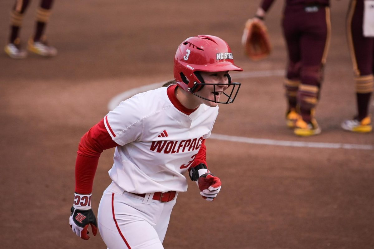 Freshman utility Morgen Talley shouts while rounding the bases after hitting a home run during the game against Arizona State at Dail Softball Stadium on Wednesday, March 25, 2026. The Wolfpack fell to the Sundevils 7-3.