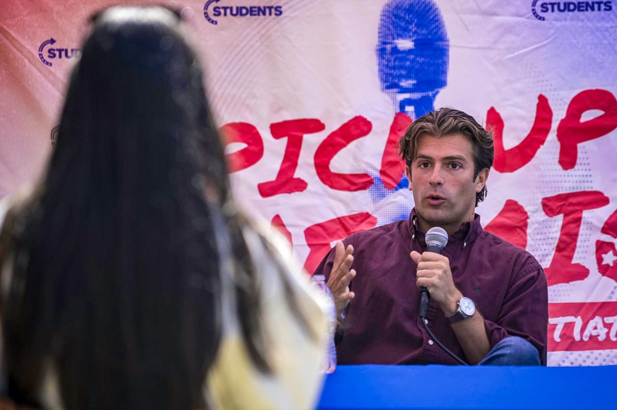 Political commentator Will Witt debates with students during Turning Point Action's "Prove Me Wrong" event on Harris Field on Monday, March 30, 2026. 