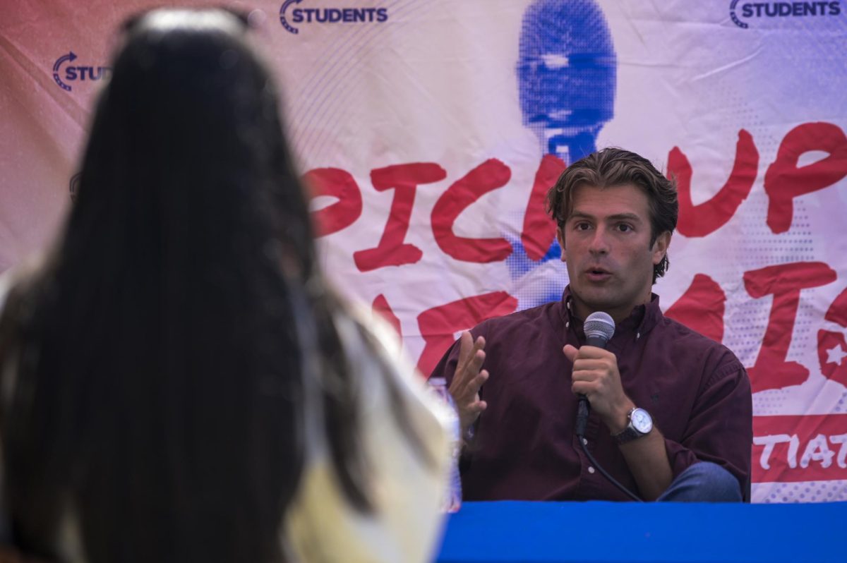 Political commentator Will Witt debates with students during Turning Point Action's "Prove Me Wrong" event on Harris Field on Monday, March 30, 2026. 