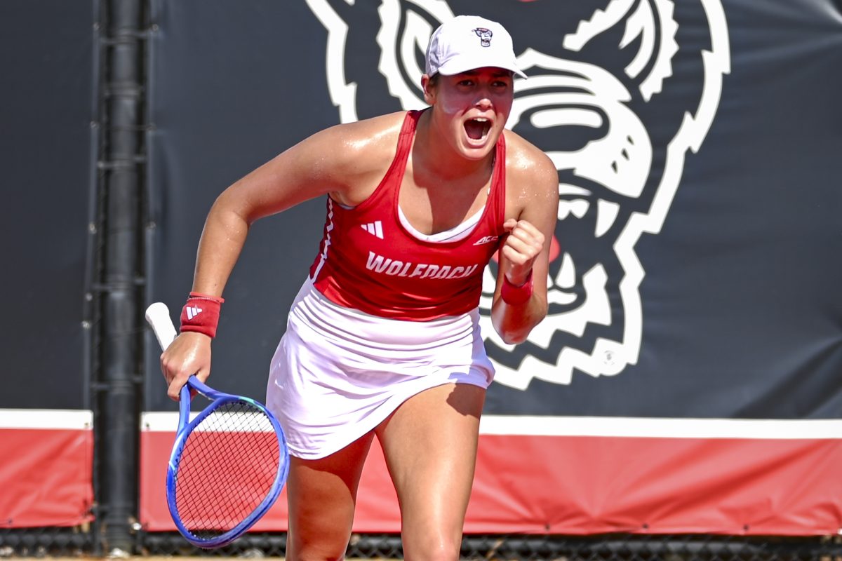 Sophomore Mia Slama does a celebratory cheer during the match against Florida State at Dail Outdoor Tennis Stadium on Friday, March 6. 2026. Slama won her singles match 6-1.6-3. NC State beat Florida State 4-0.