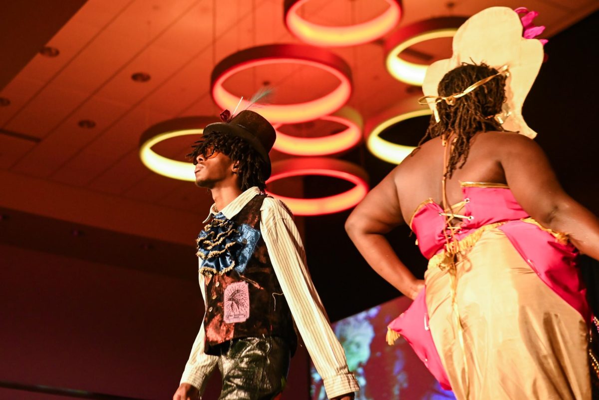 The models for Brooklyn Brown, a first-year studying fashion and apparel design, and Peter Centeno, a first-year studying fashion and textile design, display their work during the African American Textile Society Fashion Exposé at Talley State Ballroom on Monday, April. 20, 2026. This was the African American Textile Society 28th Annual Fashion Exposé focusing on culture and Heritage.  