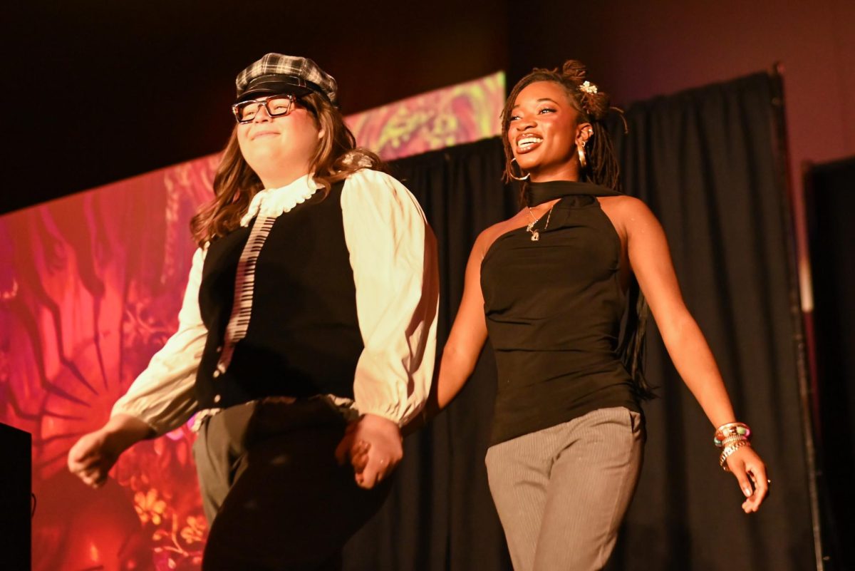Brooklyn Brown, a first-year studying fashion and apparel design, and Peter Centeno, a first-year studying fashion and textile design, come out for their designer walk during the African American Textile Society Fashion Exposé at Talley State Ballroom on Monday, April. 20, 2026. This was the African American Textile Society 28th Annual Fashion Exposé focusing on culture and Heritage. 
