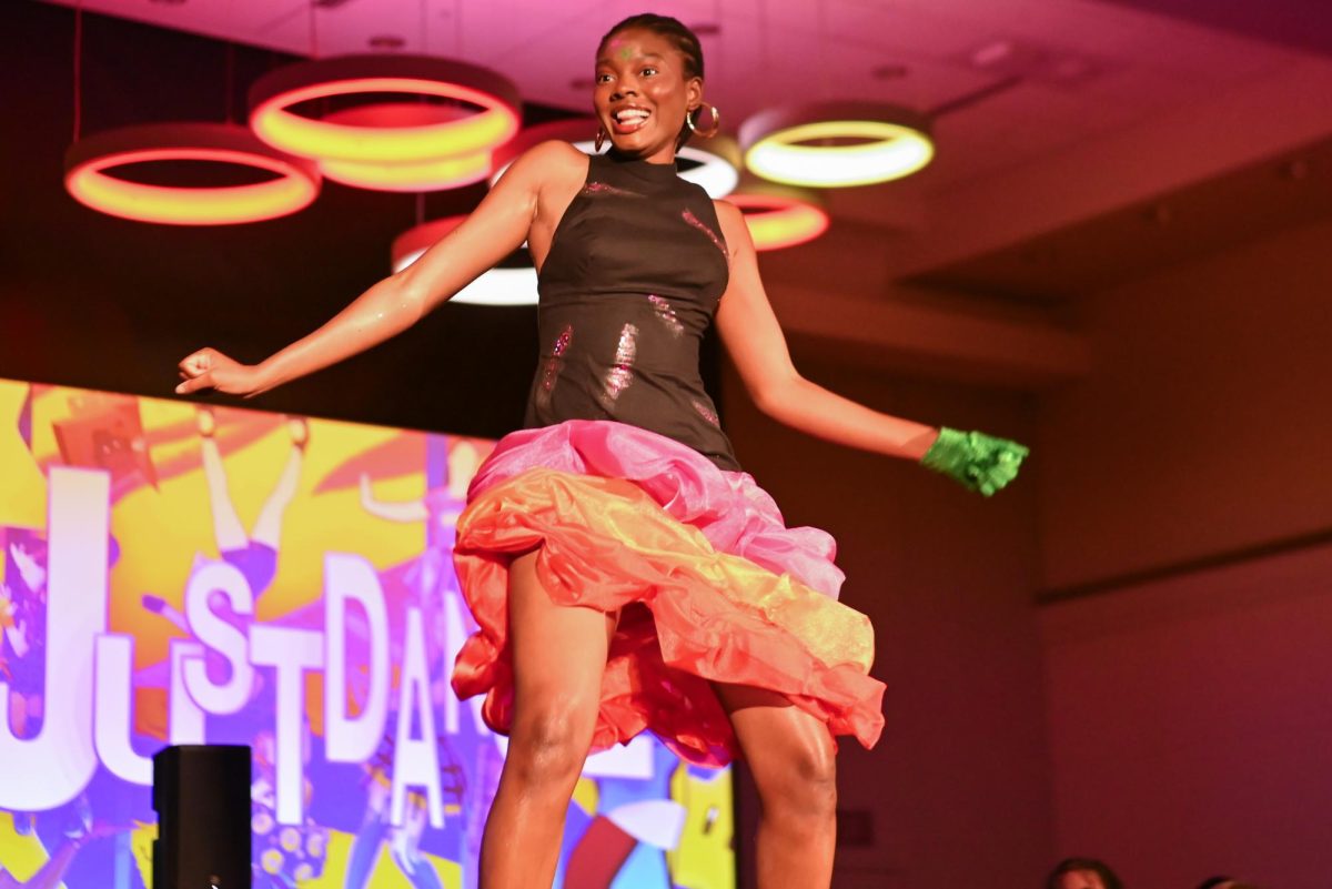 Ire Debayo-Doherty, a fourth-year student studying computer science, models for  the Just Dance collection by Victoria Barrett, a third-year studying fashion textile management, during the African American Textile Society Fashion Exposé at Talley State Ballroom on Monday, April. 20, 2026. This was the African American Textile Society 28th Annual Fashion Exposé focusing on culture and Heritage. 