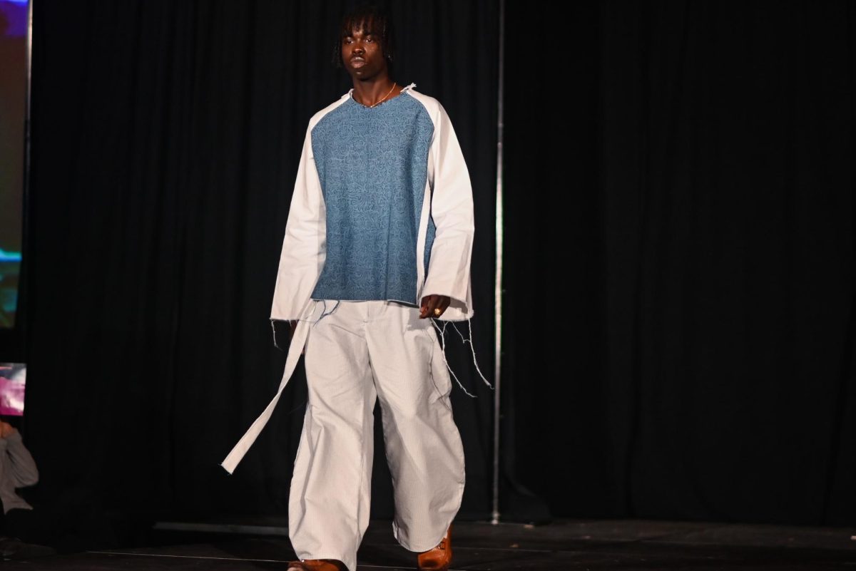 The model for Fred Pierce Jr., a third-year student studying fashion textile management, displays his work during the African American Textile Society Fashion Exposé at Talley State Ballroom on Monday, April. 20, 2026. This was the African American Textile Society 28th Annual Fashion Exposé focusing on culture and Heritage.
