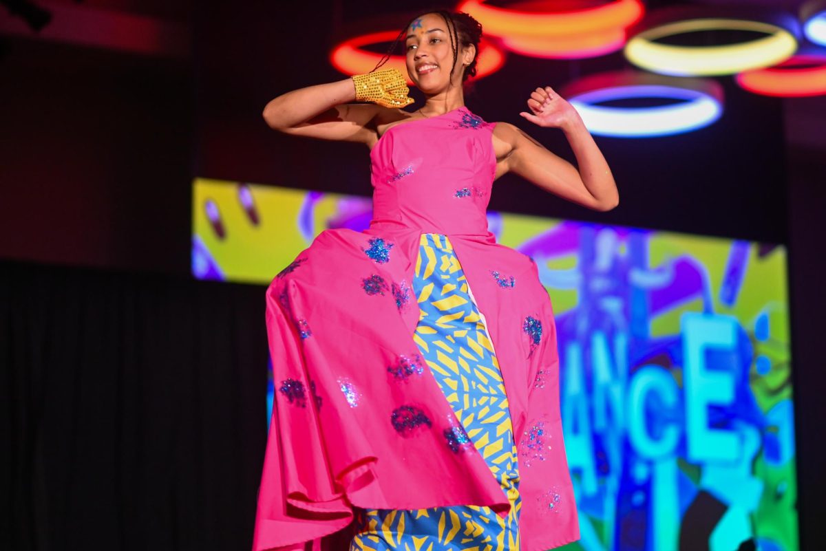 Victoria Sagne, a third-year studying chemical engineering, models for the Just Dance collection by Victoria Barrett, a third-year studying fashion textile management, during the African American Textile Society Fashion Exposé at Talley State Ballroom on Monday, April. 20, 2026. This was the African American Textile Society 28th Annual Fashion Exposé focusing on culture and Heritage. 