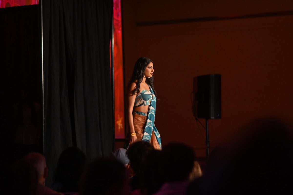 The model for Aayushi Shah, a second-year studying fashion textile management,  displays her I’m Sorry, Sari collection during the African American Textile Society Fashion Exposé at Talley State Ballroom on Monday, April. 20, 2026. This was the African American Textile Society 28th Annual Fashion Exposé focusing on culture and Heritage. 
