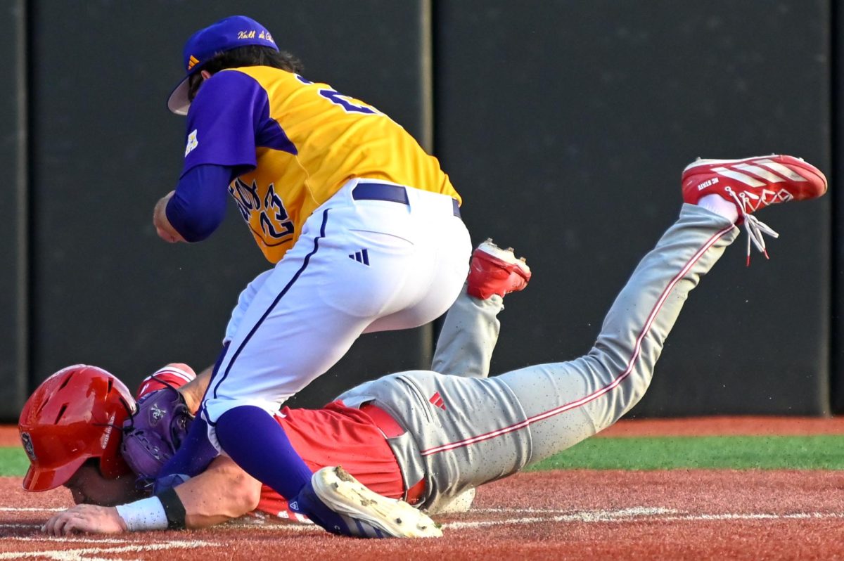 Freshman catcher Vincent DeCarlo dives home during the game against East Carolina at Clark–LeClair Stadium on Tuesday, April 15, 2026. DeCarlo had one hit in three at bats. NC State beat ECU 10-3.