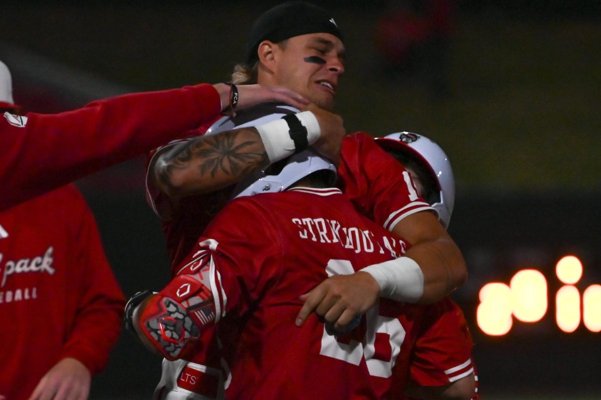 Sophomore outfielder Ty Head hugs senior outfielder Brayden Fraasman during the game against East Carolina at Doak field at Dail park on Tuesday, April 28, 2026. Head and Fraasman combined for threee hits. NC State beat ECU 12-2.