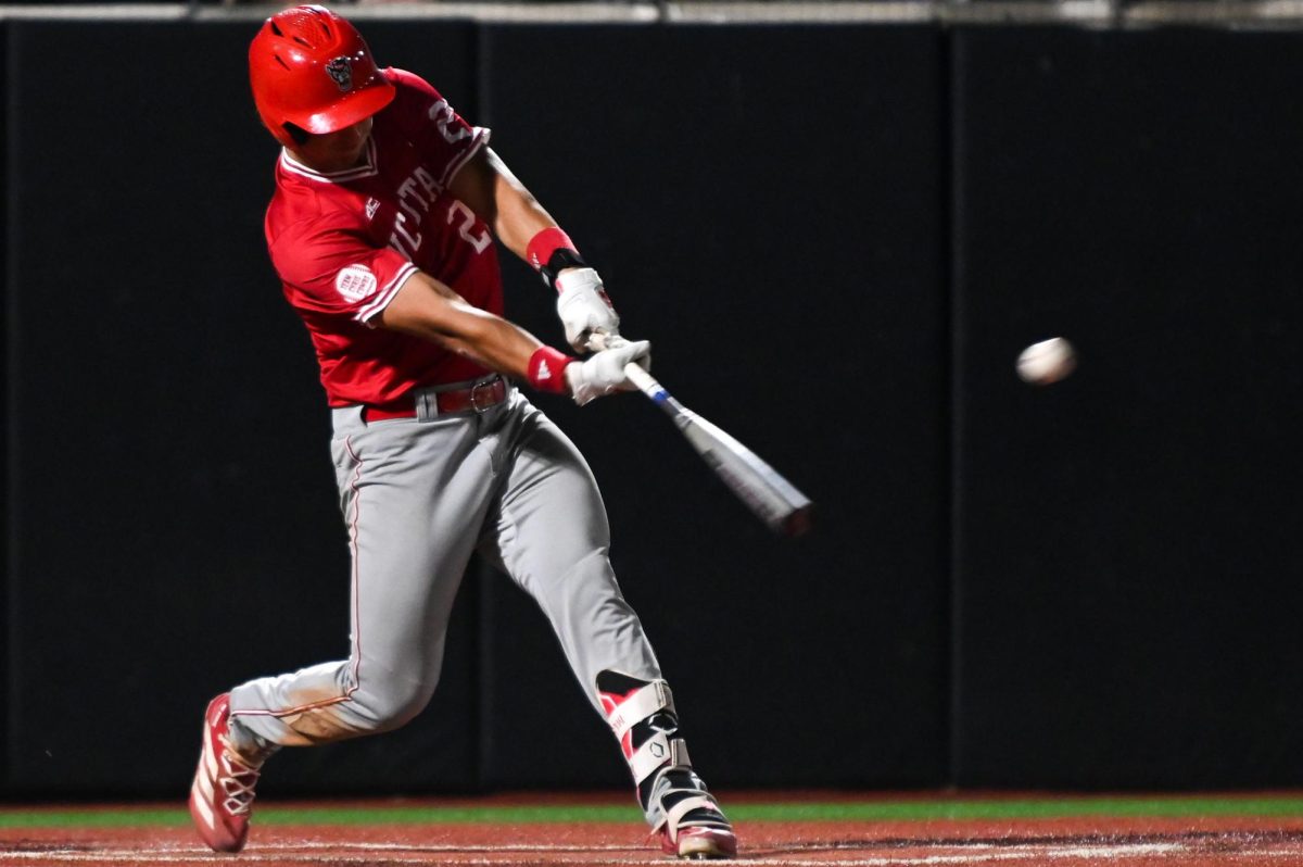 Junior infielder Chris McHugh hits the ball during the game against East Carolina at Clark–LeClair Stadium on Tuesday, April 15, 2026. McHugh had one hit in two at bats. NC State beat ECU 10-3.