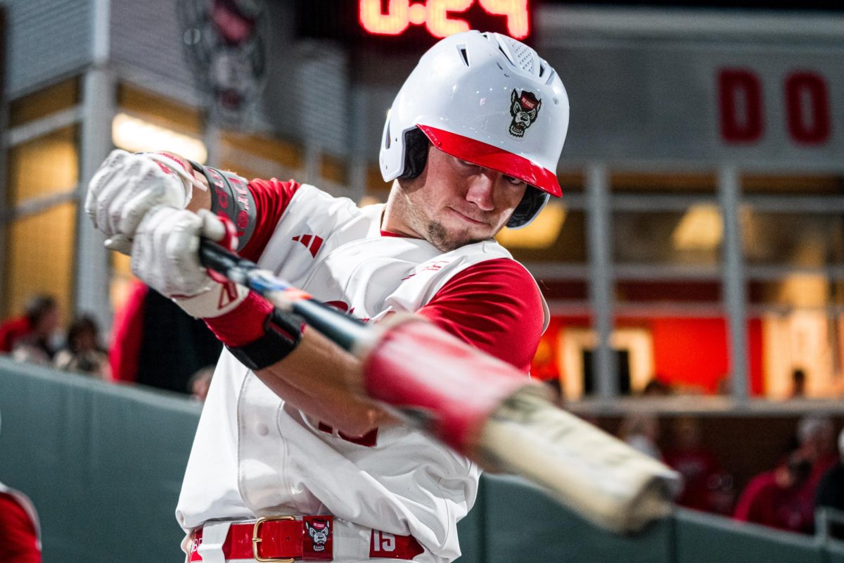Redshirt-junior catcher Drew Lanphere swings the bat while warming up during the game against Duke at Doak Field at Dail Park on Friday, April 10, 2026. The Wolfpack beat the Blue Devils 10-4.