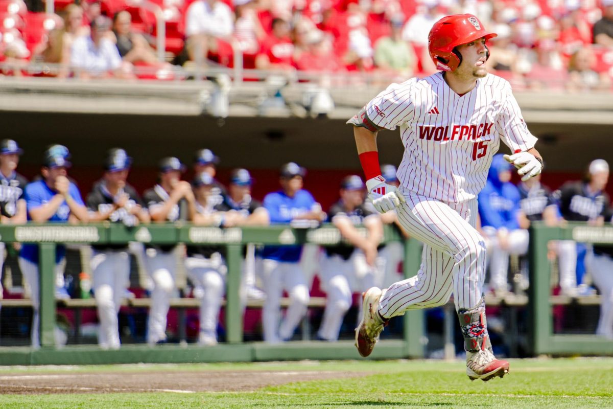 Redshirt junior Drew Lanphere races to first during the game against Duke at Doak Field at Dail Park on Sunday, April 12, 2026. NC State fell to Duke 3-2. 