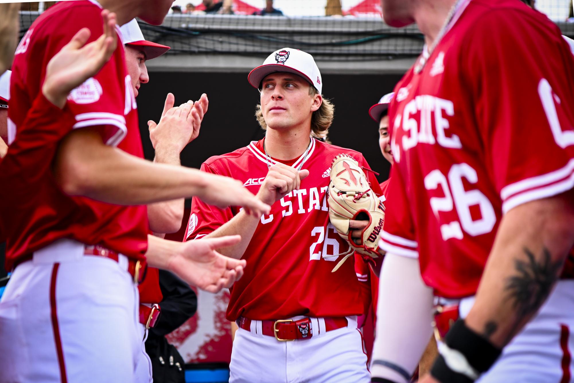 Redshirt-junior right-hand pitcher Julien Peissel emerges from the dugout during the game against ECU at Doak Field at Dail Park on Tuesday, April 28, 2026. The Wolfpack defeated the Pirates 12-2.