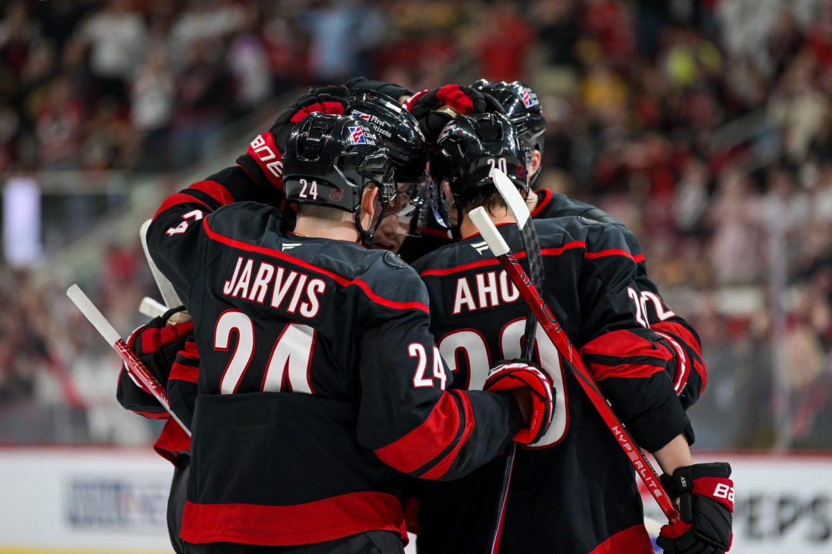 Celebration huddle after right wing Andrei Svechnikov scores the Hurricanes’ first goal of the game versus the Boston Bruins at the Lenovo Center on Tuesday, April 7, 2026. The Canes defeated the Bruins in OT 6-5.