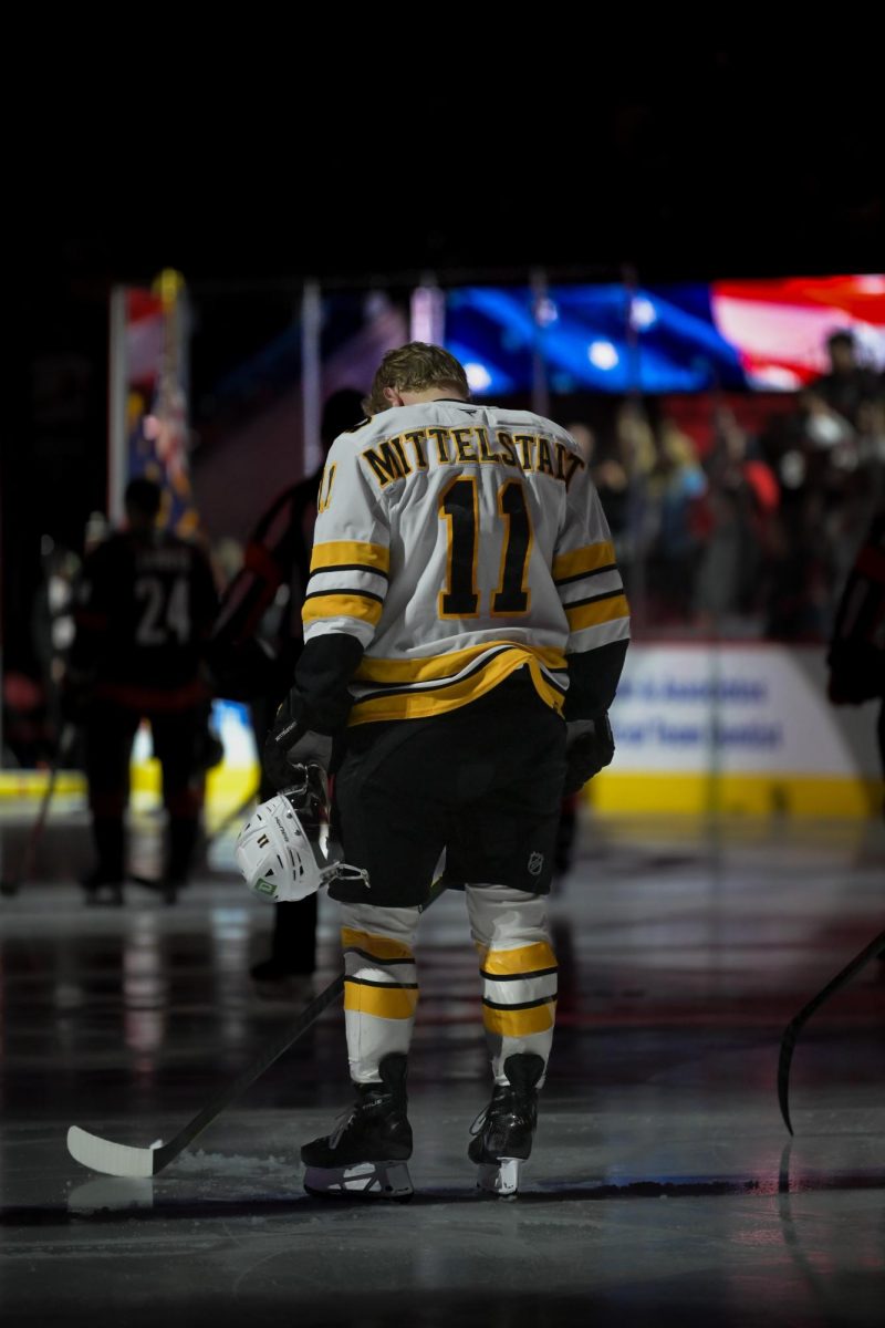 Boston center Casey Mittelstadt during the singing of the national anthem before the game versus the Carolina Hurricanes at the Lenovo Center on Tuesday, April 7, 2026.  The Canes defeated the Bruins in OT 6-5.