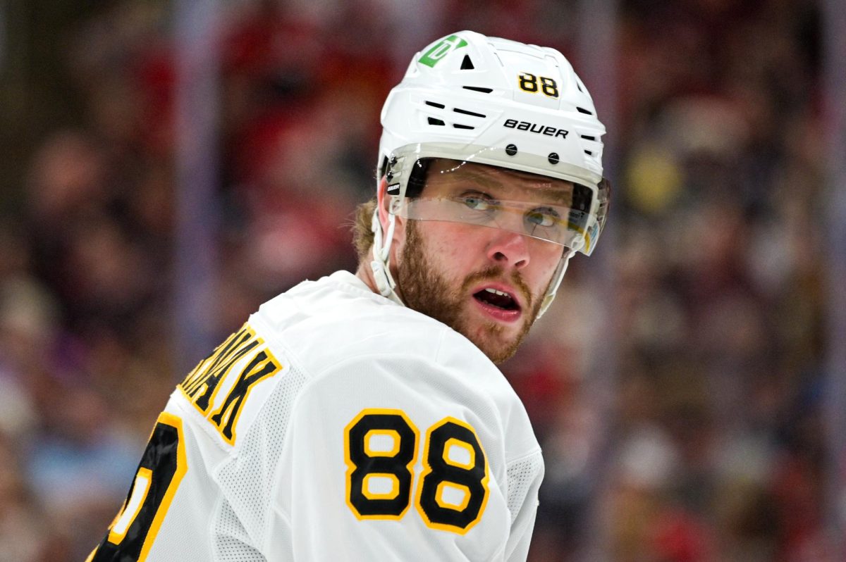 Boston right wing David Pastrnak looks back after a play during the game versus the Carolina Hurricanes at the Lenovo Center on Tuesday, April 7, 2026. Pastrnak had two assists. The Canes defeated the Bruins in OT 6-5.