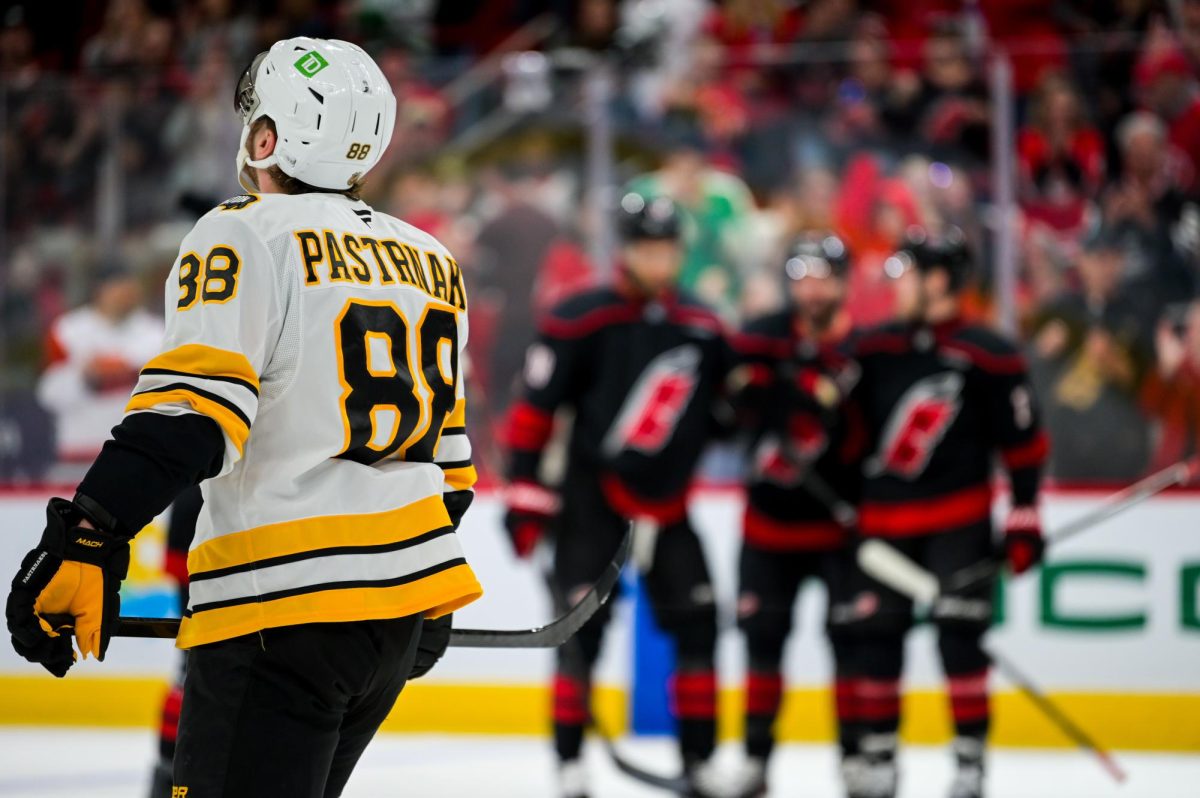 Boston right wing David Pastrnak looks up at the replay of Hurricane’s defenseman K'Andre Miller's goal during the game versus the Carolina Hurricanes at the Lenovo Center on Tuesday, April 7, 2026. The Canes defeated the Bruins in OT 6-5.
