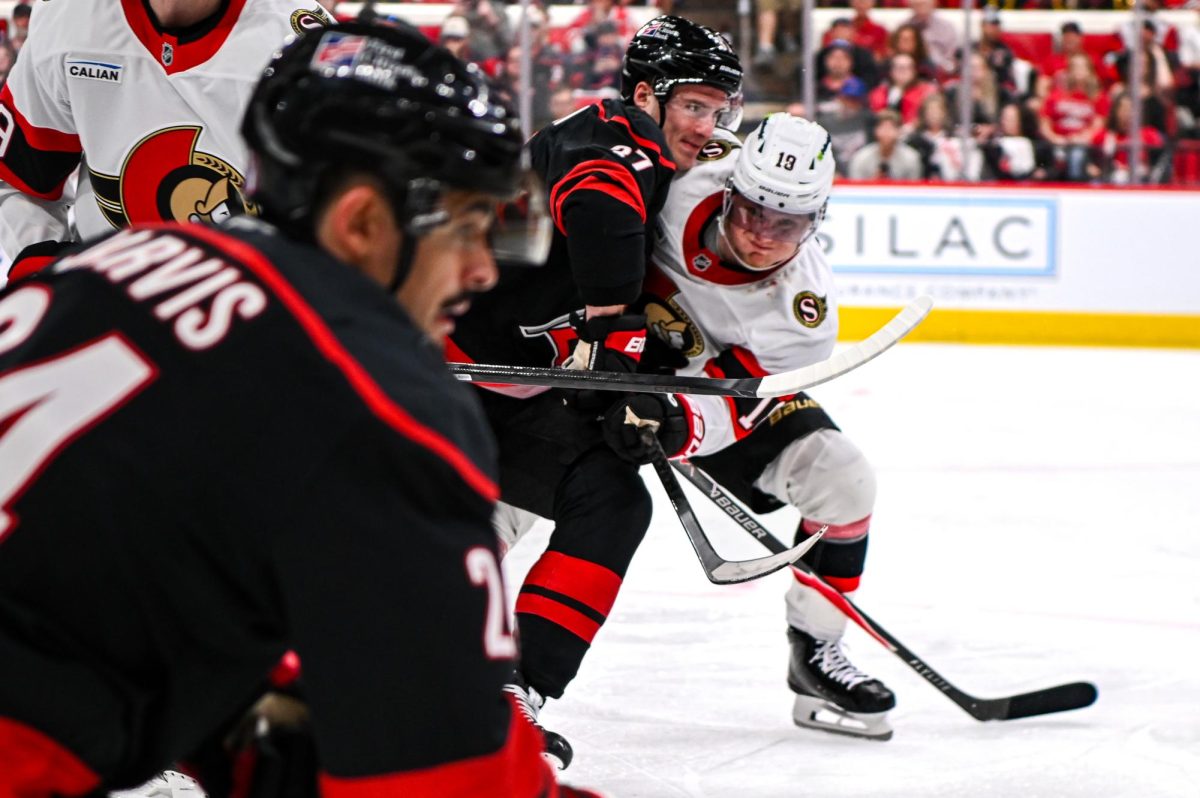 Depth perception of Canes right wing Andrei Svechnikov battling Senators right wing Drake Batherson in Game One of the Eastern Conference Playoffs at the Lenovo Center on Saturday, April. 18, 2026. The Hurricanes defeated the Senators 2-0.