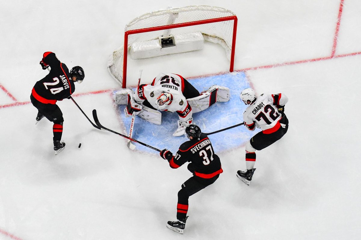 Center Seth Jarvis and right wing Andrei Svechnikov attempt to score during Game One of the Eastern Conference Playoffs against the Ottawa Senators at the Lenovo Center on Saturday, April. 18, 2026. The Hurricanes defeated the Senators 2-0.