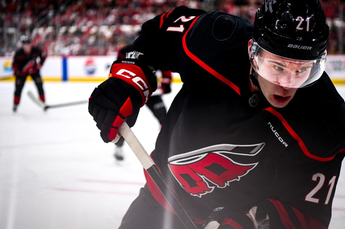 Defenseman Alexander Nikishin battles for the puck in Game One of the Eastern Conference Playoffs against the Ottawa Senators at the Lenovo Center on Saturday, April. 18, 2026. The Hurricanes defeated the Senators 2-0.