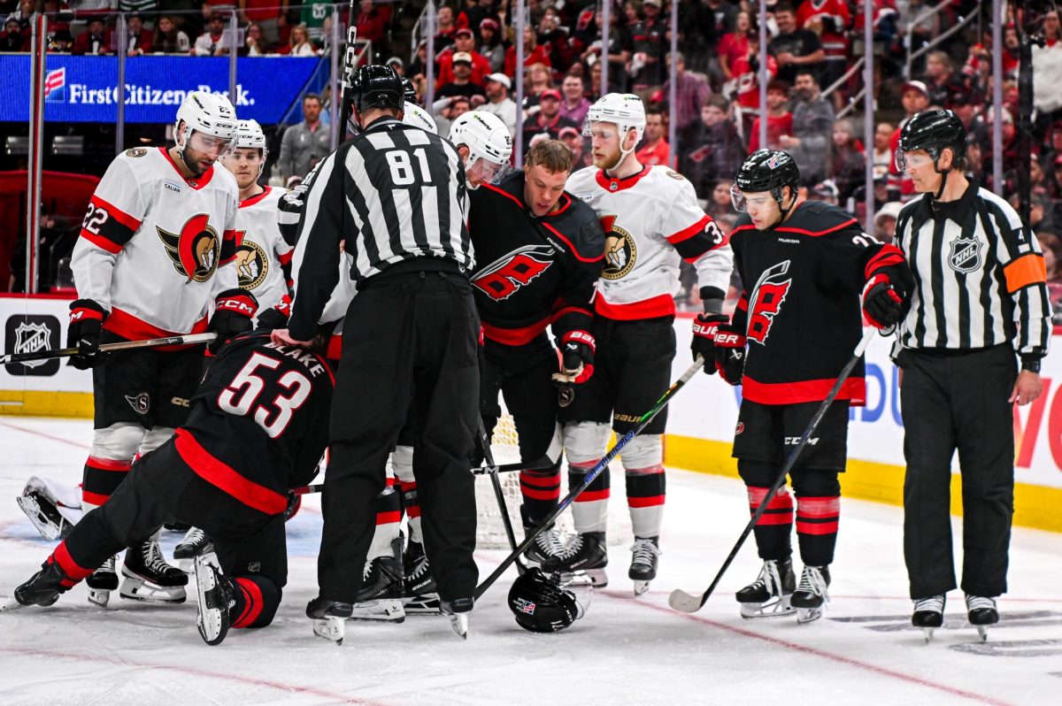 Referees stop play after an attempt to score by the Canes led to roughing in Game One of the Eastern Conference Playoffs against the Ottawa Senators at the Lenovo Center on Saturday, April. 18, 2026. The Hurricanes defeated the Senators 2-0.