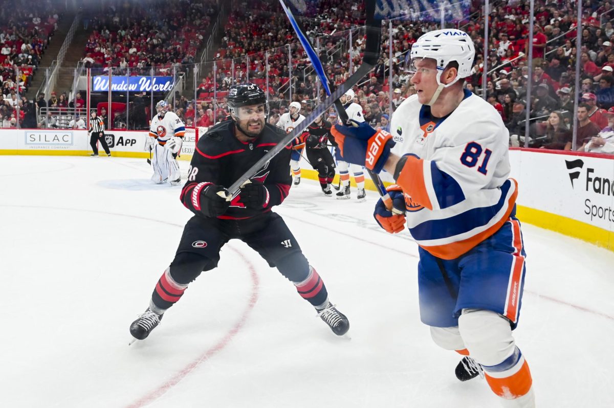 Left wing William Carrier battles an opponent for the puck during the game versus the New York Islanders at the Lenovo Center on Saturday, April 4, 2026. The Hurricanes beat the Islanders 4-3.