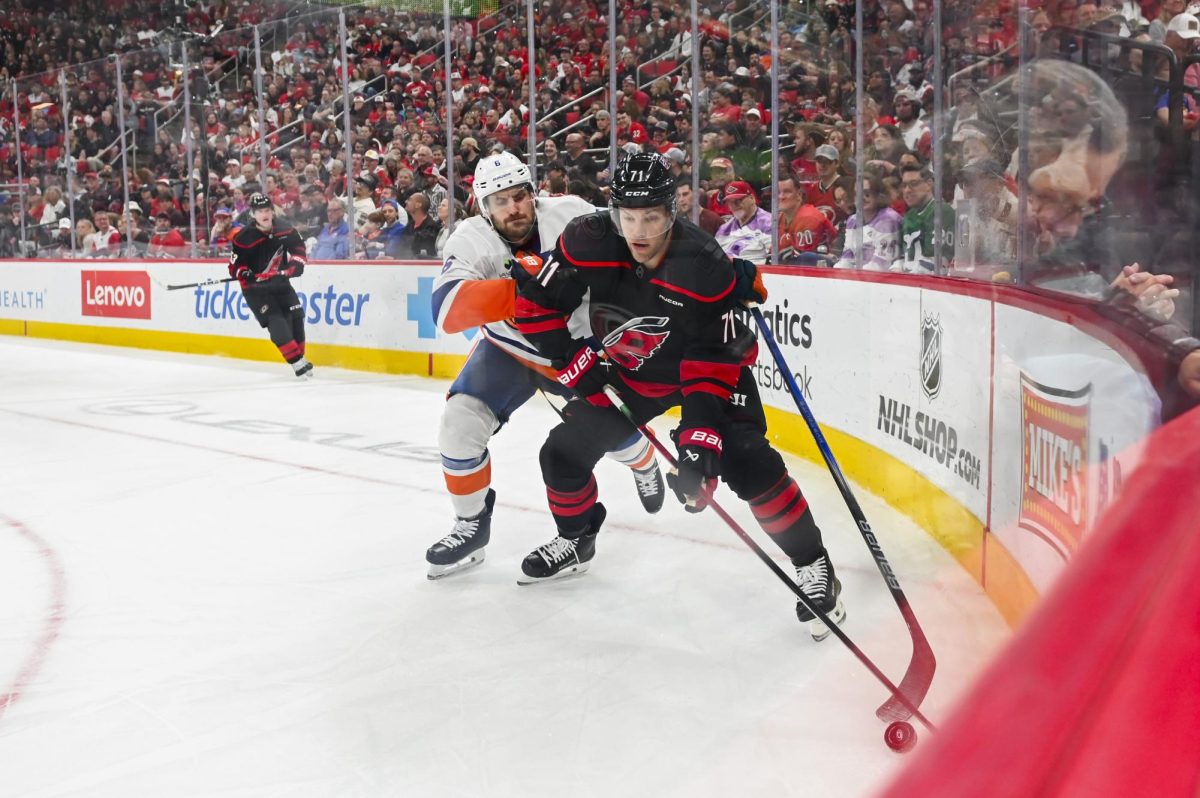 Left wing Taylor Hall battles an opponent for the puck during the game versus the New York Islanders at the Lenovo Center on Saturday, April 4, 2026. The Hurricanes beat the Islanders 4-3.