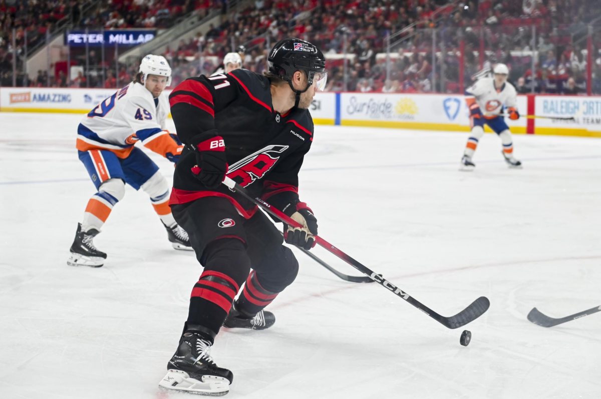 Left wing Taylor Hall guards the puck during the game versus the New York Islanders at the Lenovo Center on Saturday, April 4, 2026. The Hurricanes beat the Islanders 4-3.