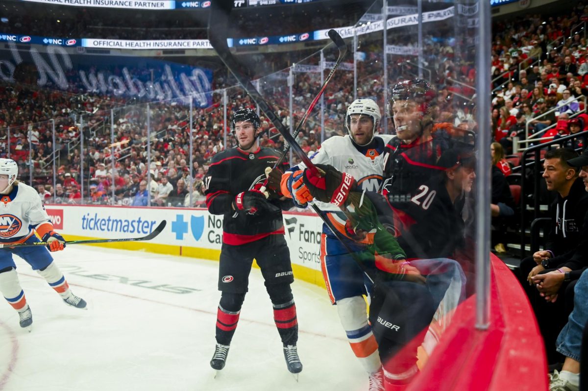 Right wing Andrei Svechnikov and center Sebastian Aho battle an opponent during the game versus the New York Islanders at the Lenovo Center on Saturday, April 4, 2026. Aho scored one goal for the Hurricanes. The Hurricanes beat the Islanders 4-3.